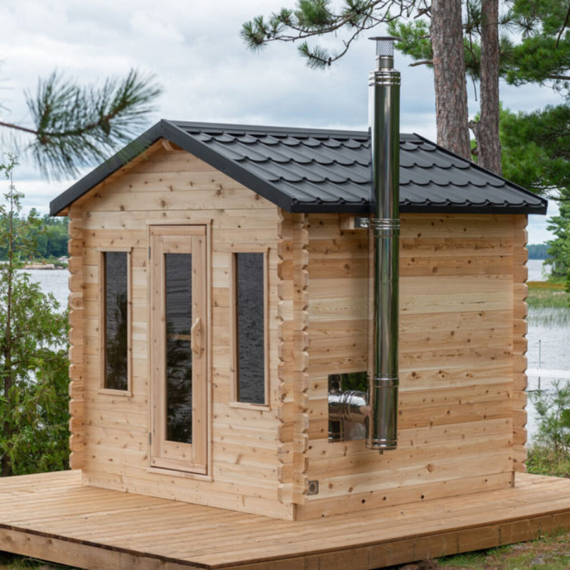 Georgian Cabin Sauna with light Eastern White Cedar and matte black steel roof, featuring two-tier benches and bronze-tinted windows.