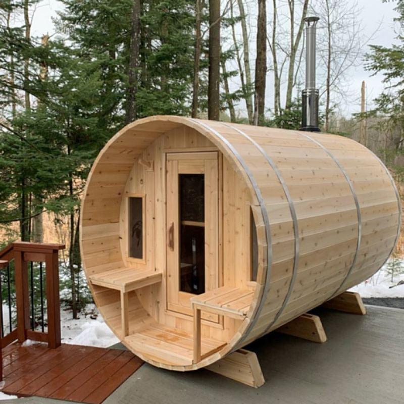 "Luxurious Canadian Timber Tranquility Barrel Sauna crafted from light-colored Eastern White Cedar, featuring a front porch with windows and spacious cedar benches, ideal for relaxation and social gatherings."