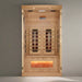 "Relaxing solo session in the Golden Designs 1-2 Person Full Spectrum Infrared Sauna, featuring Himalayan Salt Bars and Near Zero EMF technology, set in a serene home environment."