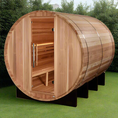 "Golden Designs 'Klosters' 6-Person Barrel Steam Sauna in Pacific Cedar with Privacy Glass Door and Outdoor Setting."