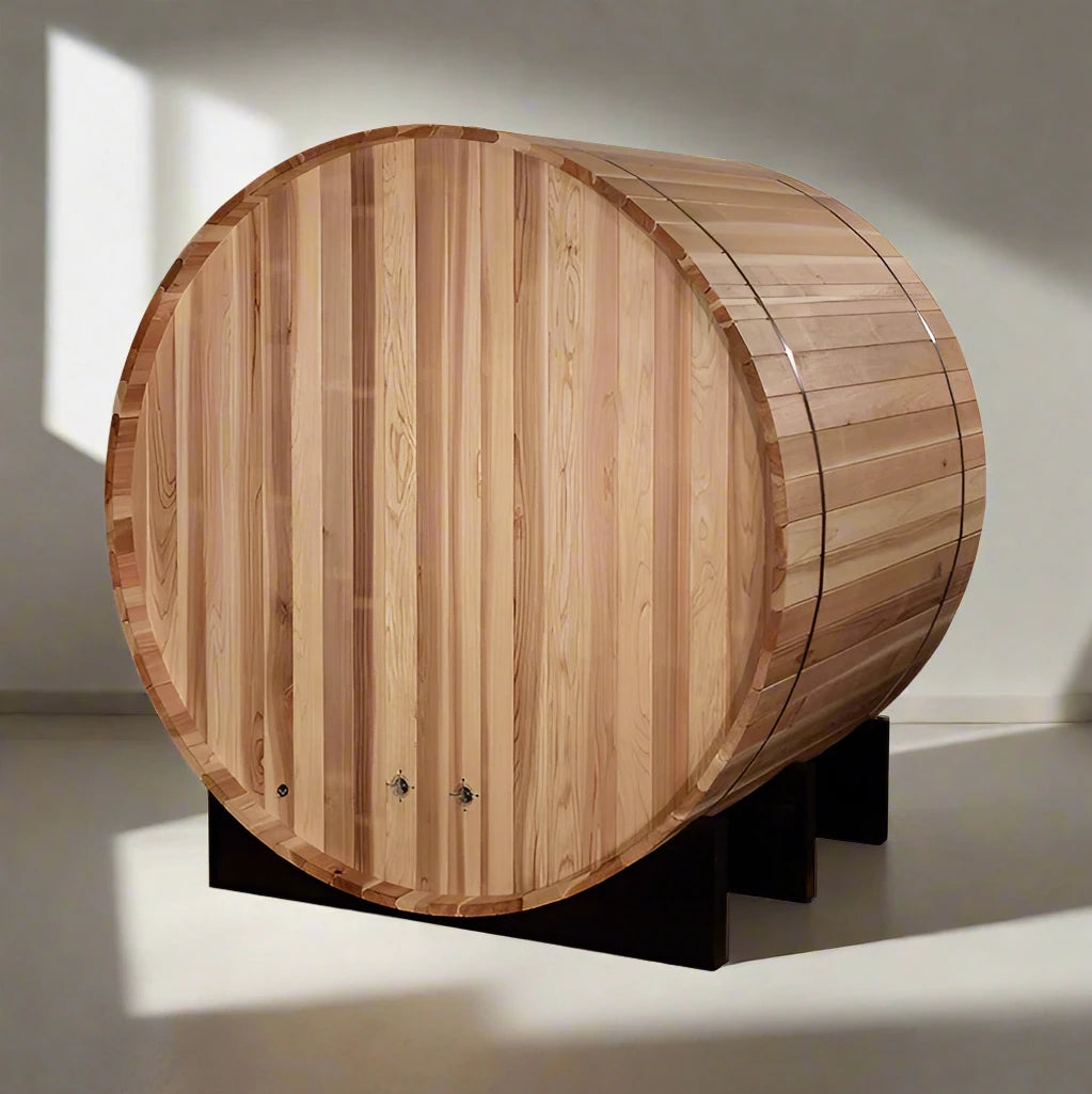 "Two friends enjoying a steamy session in the Golden Designs St. Moritz 2-Person Barrel Steam Sauna, set outdoors surrounded by nature, featuring durable Pacific Cedar construction and privacy glass."