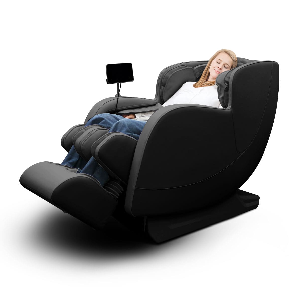 Woman relaxing in black zero-gravity massage chair with tablet holder