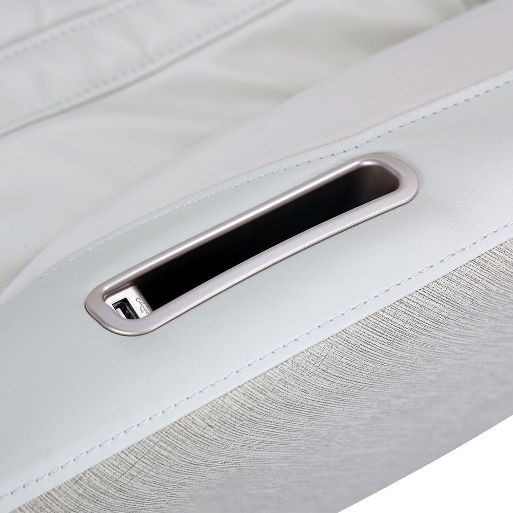 Closeup of massage chair armrest with phone slot and USB charger