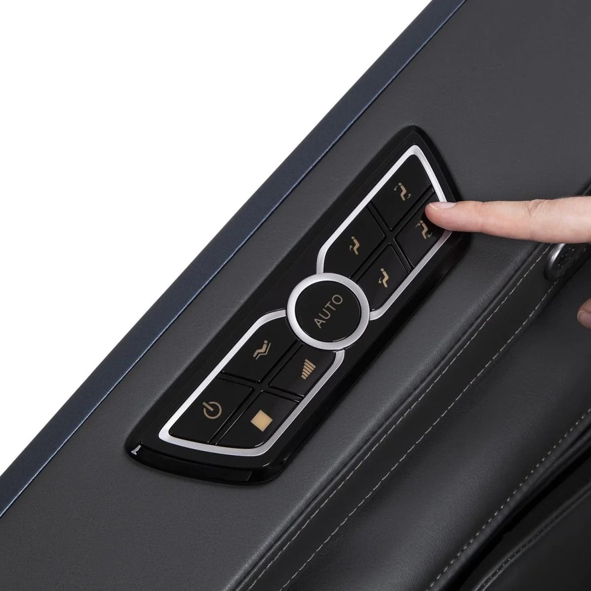 Hand pressing button on massage chair armrest control panel with AUTO center button
