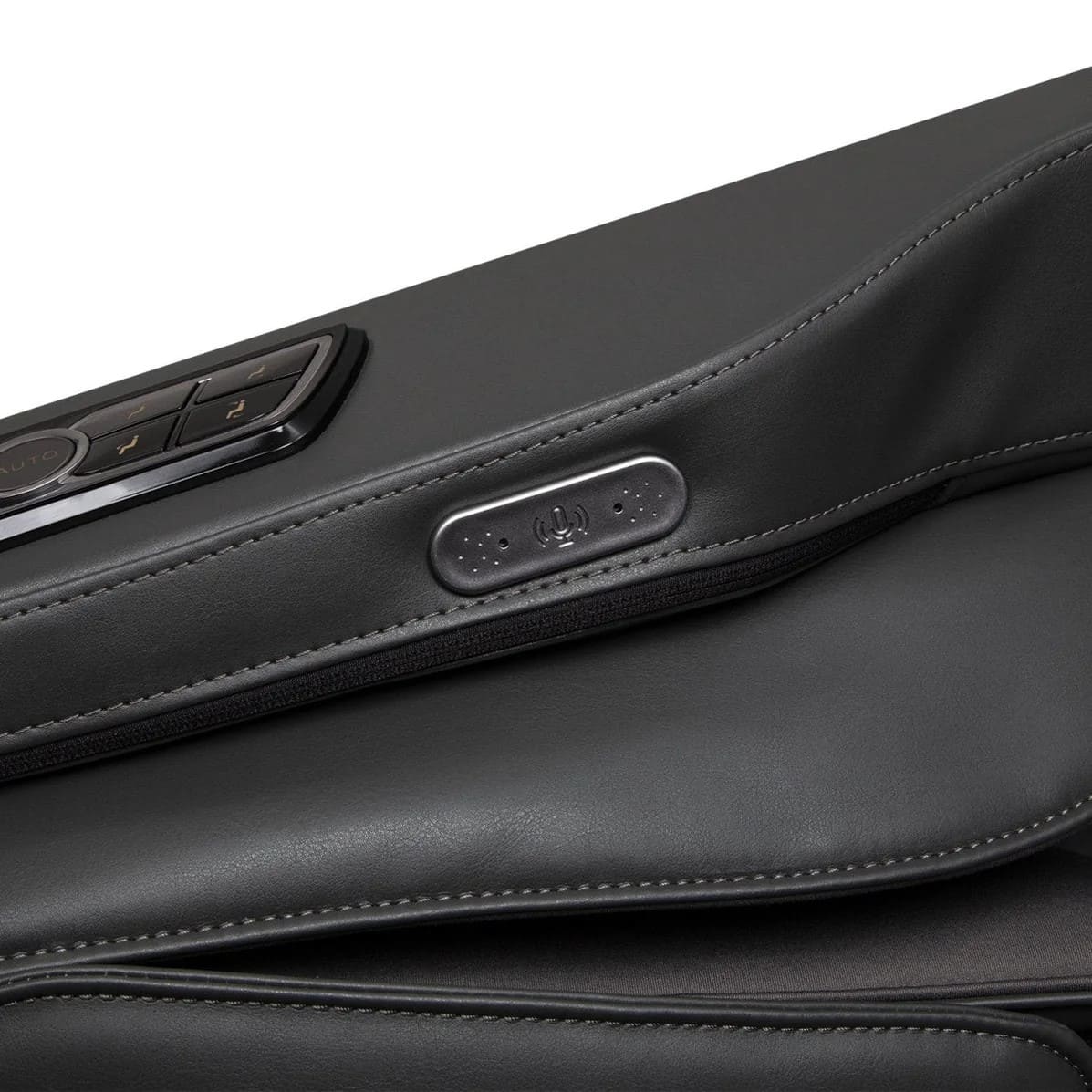 Close-up of massage chair armrest showing built-in voice control microphone button
