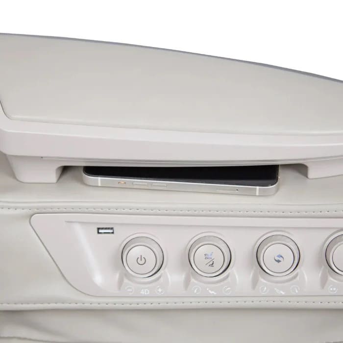 Close-up of armrest controls and wireless charging tray on the OS-Pro 4D DuoMax SE
