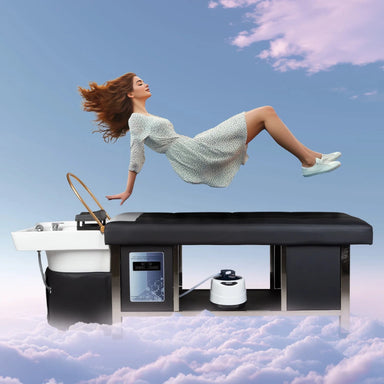 Woman in a dress floating over a black shampoo bed with a white sink