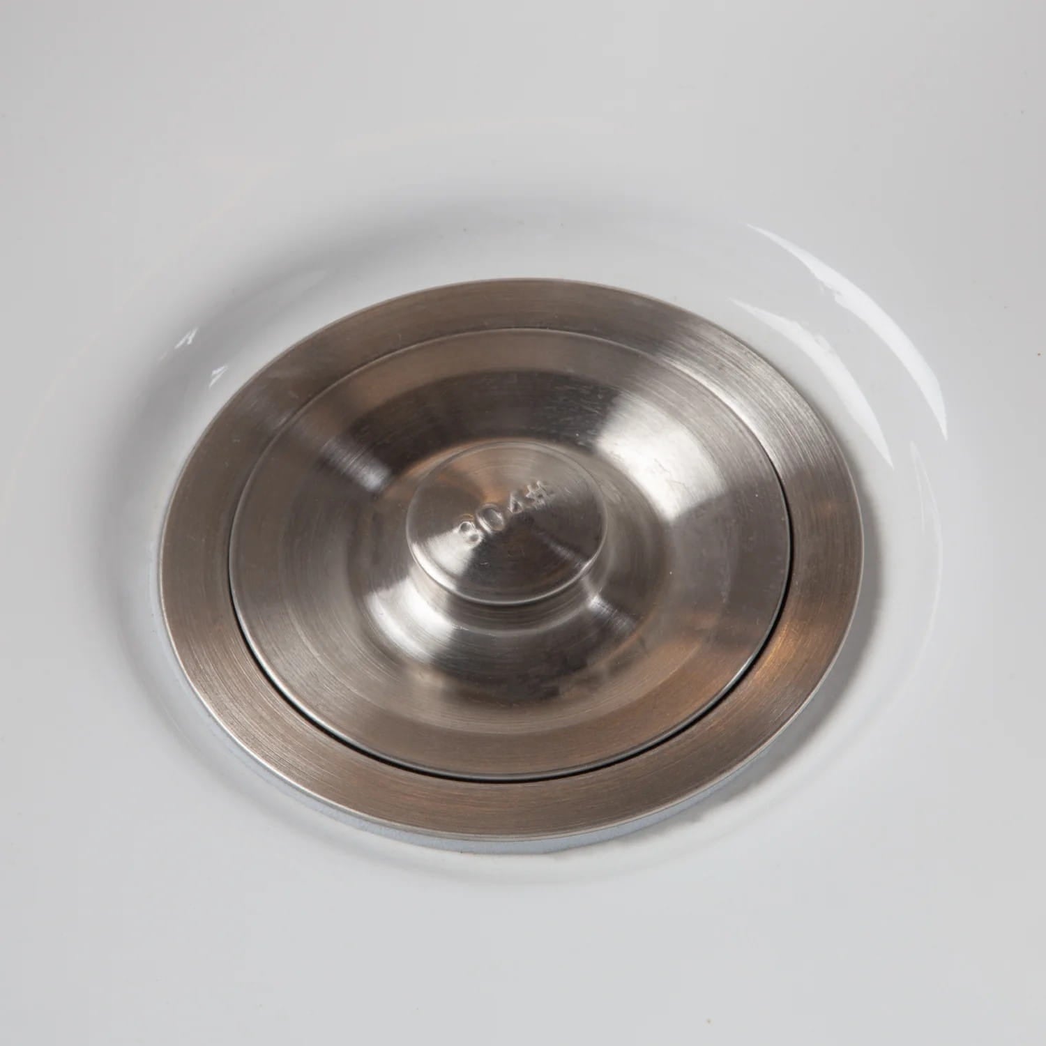 Closeup of closed drain on Kai Shampoo Bed