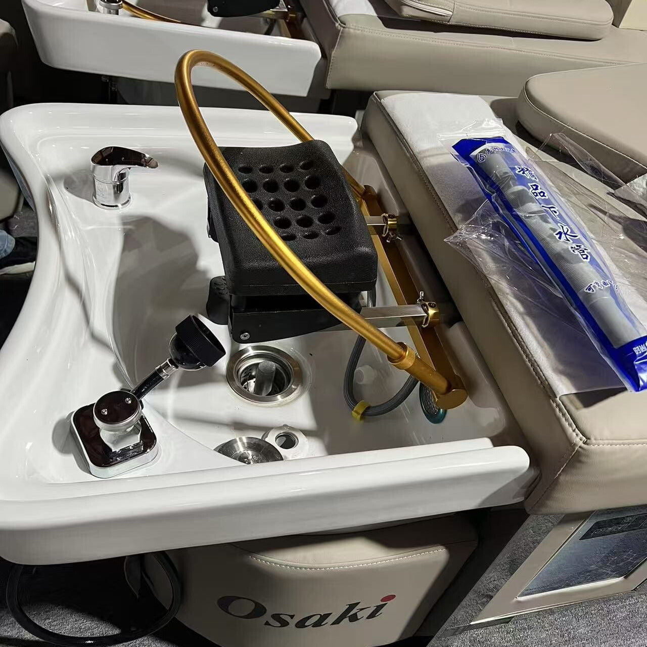 Shampoo Bed headrest and white sink on beige bed