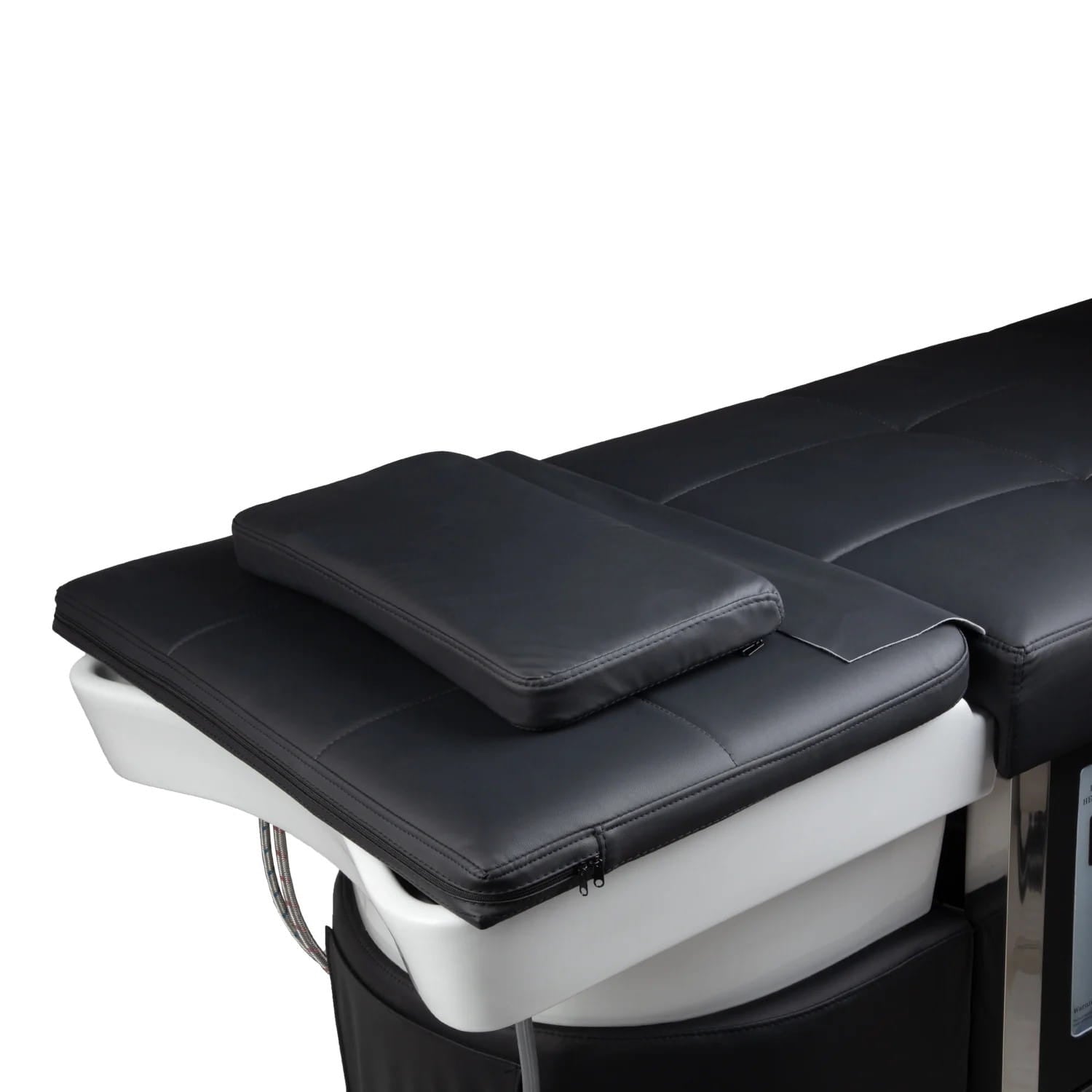 aerial view of black shampoo bed with pillow