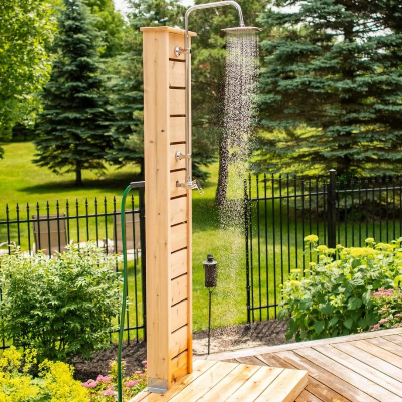 "Sierra Pillar outdoor shower setup next to a pool, featuring stainless steel and Eastern White Cedar design, ready for a refreshing outdoor experience."