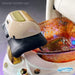 Pedicure footrest over an amber glass bowl