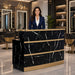 Woman standing behind reception desk in modern salon
