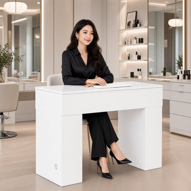 Lady sitting at manicure nail table in modern salon