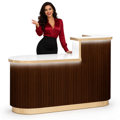 Lady in red shirt standing next to brown reception desk with LED lighting