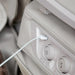 Close-up of USB charging port and control buttons on the OS-Pro 4D DuoMax SE armrest
