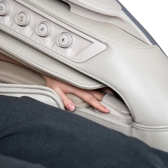 Hand demonstrating arm massage feature inside the OS-Pro 4D DuoMax SE side panel
